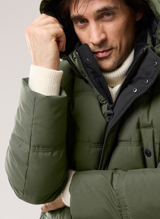 Abbildung Oberkörper Herr in Jacke