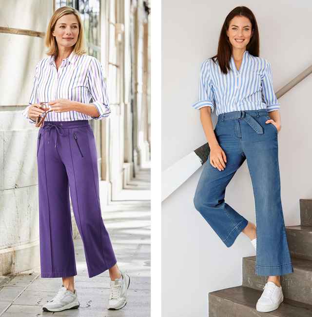 Zwei Frauen in gestreiften Hemden und weiten Hosen, eine in Lila auf der Straße, die andere in Jeans auf einer Treppe, beide mit Sneakers.